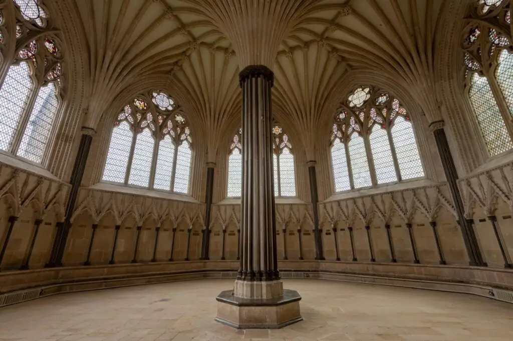 A vaulted Gothic chapter house with a central column