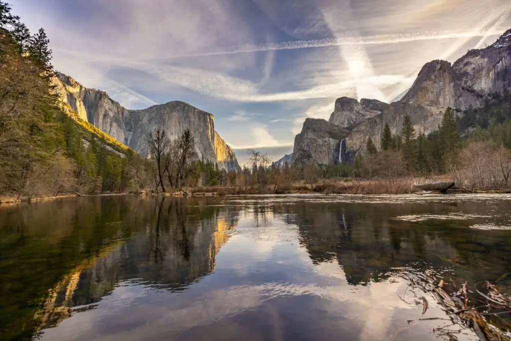 Granite cliffs reflected in a still river in Yosemite Valley, California