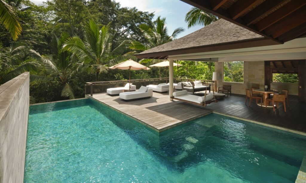 A turquoise pool and open-sided pavilion at a tropical retreat
